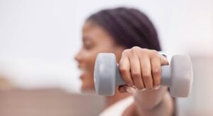 Woman lifting a dumbbell weight for exercise